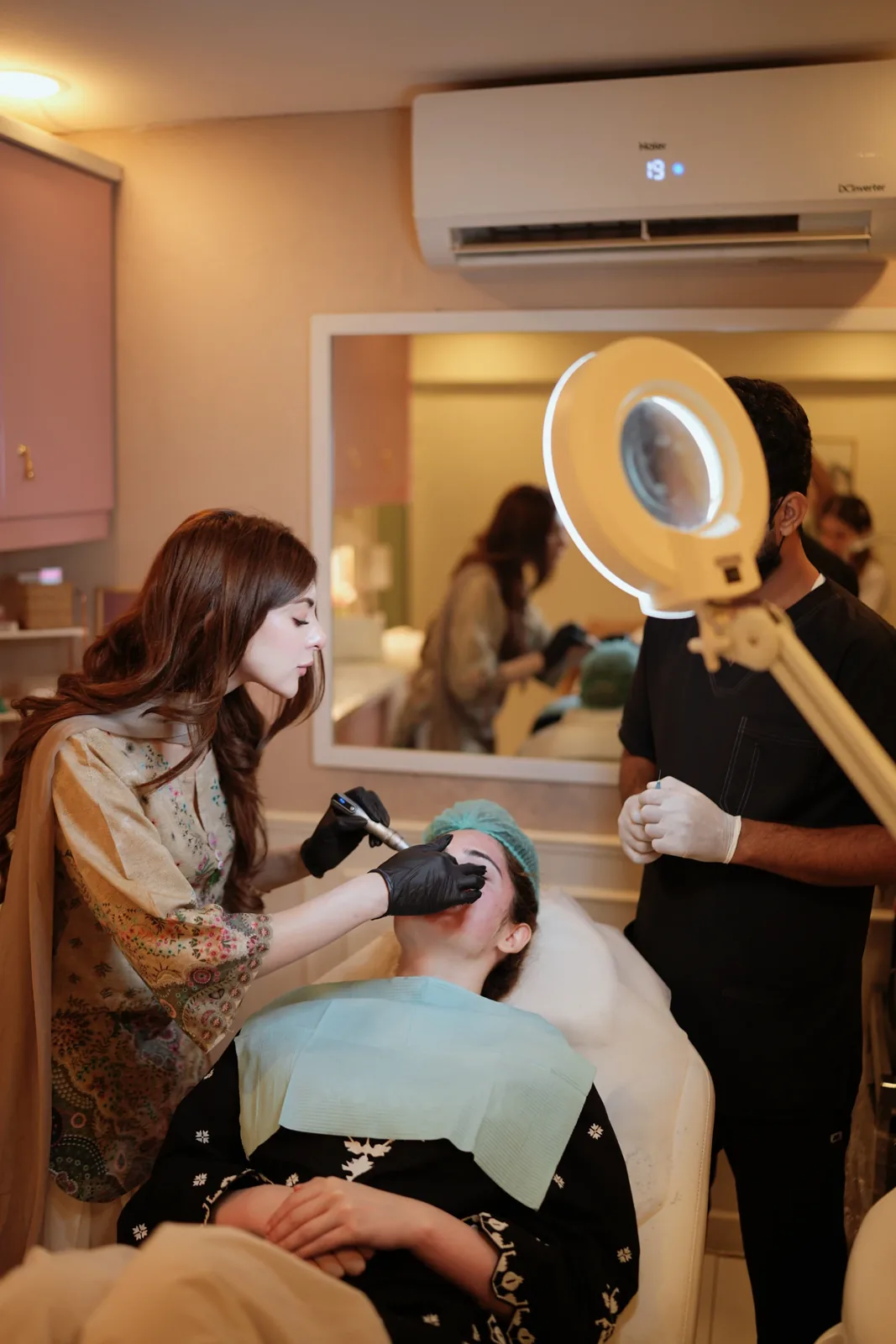 Dr. Taniya Habib treating a patient in the aesthetic treatment room
